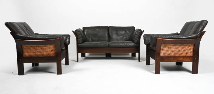DANISH LEATHER SOFA SUITE ATTR. GEORG THAMS: For Vejen Polstermobelfabrik. Includes Sofa and (2) lounge chairs. Beech frames with caning on seats, sides, backs. Dark espresso brown toned leather cushions. Denmark, circa 1960's. Dimensions: Sofa