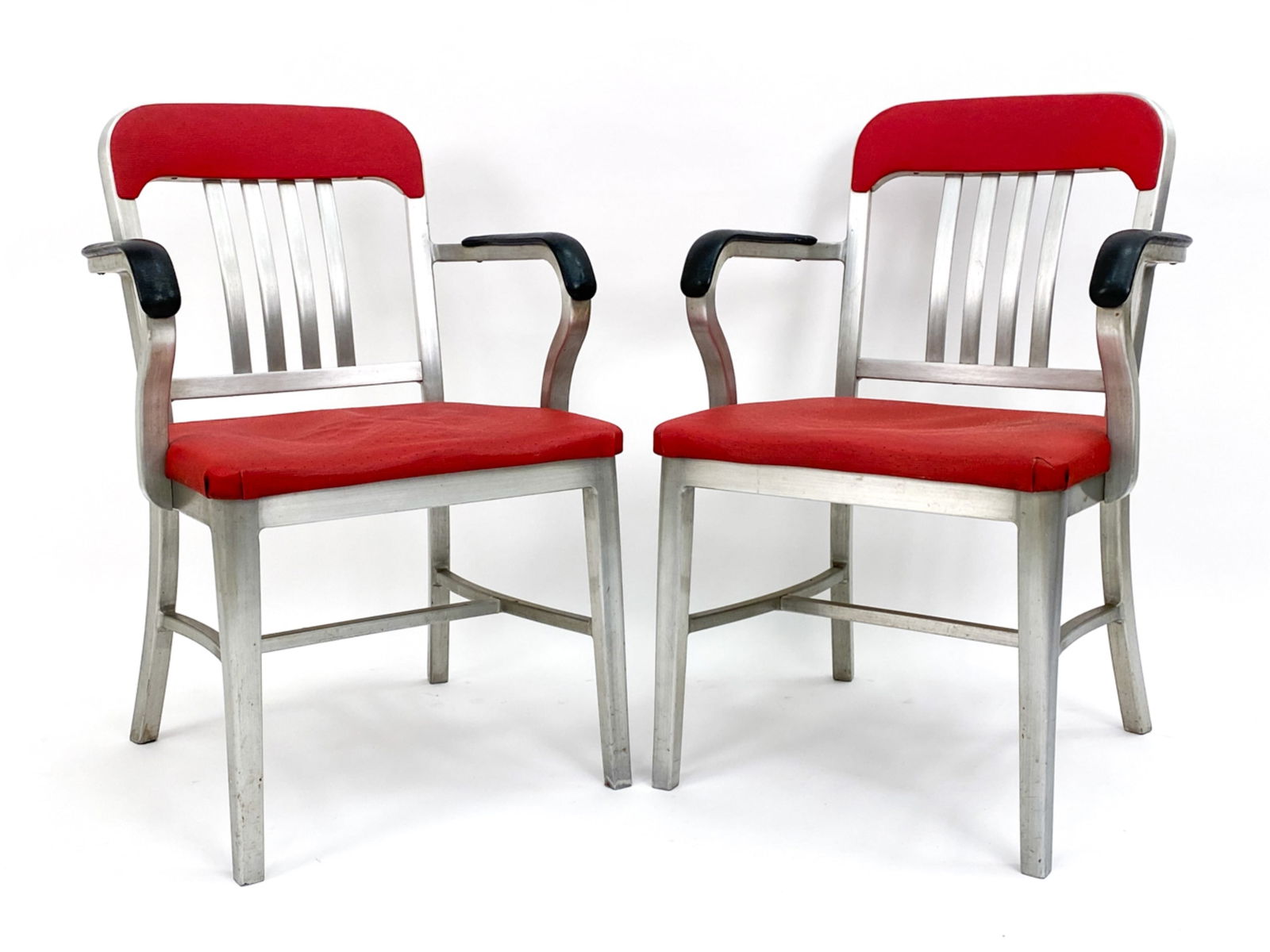 PAIR OF ALUMINUM ARMCHAIRS BY GOODFORM C.1950S: Aluminum and Vinyl chairs. Labeled on backside and underside. Circa 1951. Dimensions: H 33" W 22" D 22" SH 17" Condition: Oxidation to cushions and wearing to aluminum to underside and to legs consist