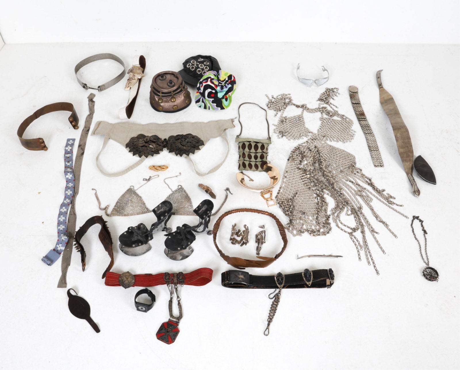 GROUPING OF ECCENTRIC COSTUME & COUTURE: Includes various clothing and accessory items ranging from belts, hats, bracelets, etc. Early to Late 20th century, some contemporary. Condition: Varying signs of wear from regular use. Some surface s