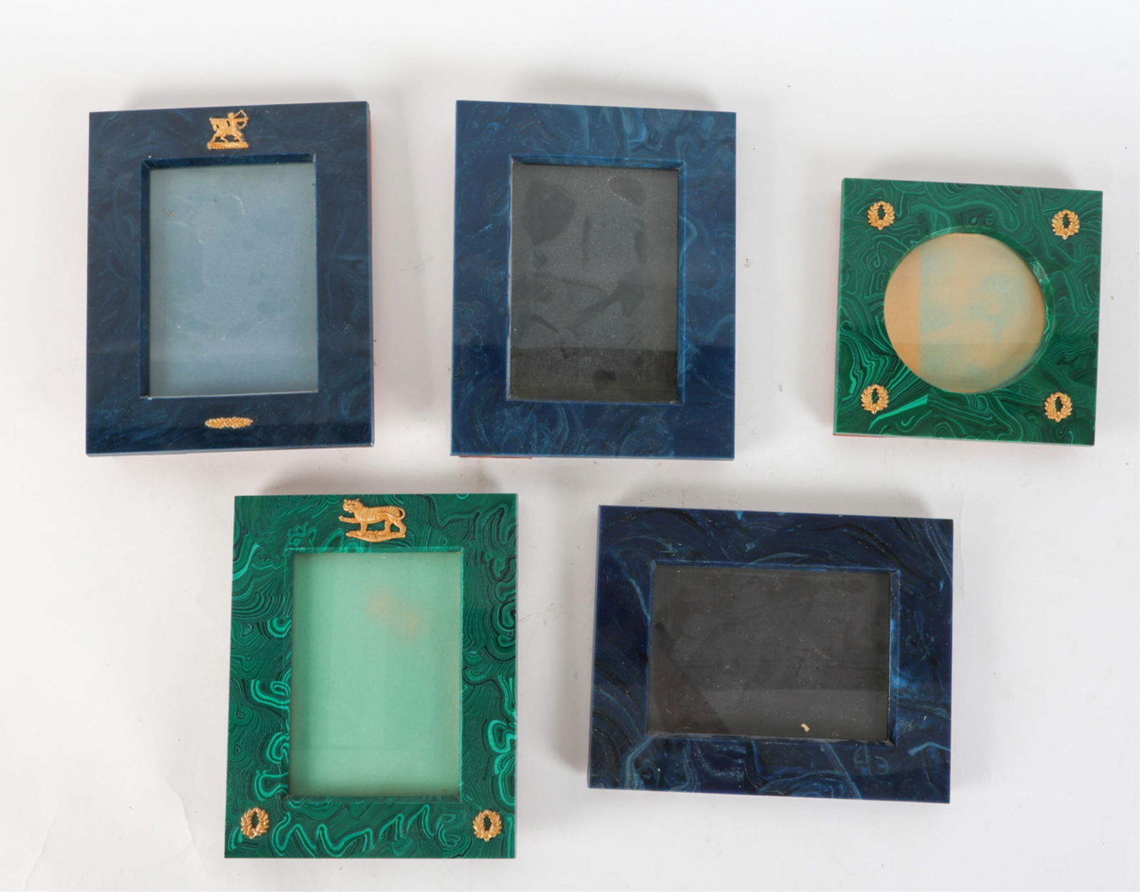 (5) MALACHITE AND LAPIS STYLE PICTURE FRAMES: Blue and green frames. Some with gilt ornaments. Dimensions: (larger) H 9.75" x W 7.75" Sight H 6.5" x W 4.5" Condition: Moderate Separation to frames from backing. Some frames are missing their easel