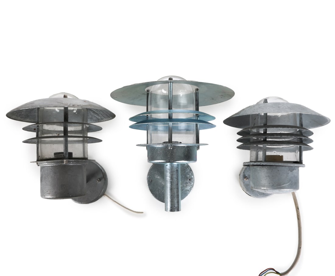 (3) NORDLUX STEEL SAUCER OUTDOOR WALL SCONCES: Denmark, circa 1980's. Dimensions: H 10.25" x W 11" x Shade Dia. 10". Condition: Wiring untested, may require rewiring. Few scuffs and spots of wear to steel finish. Wear consistent with age and outdo