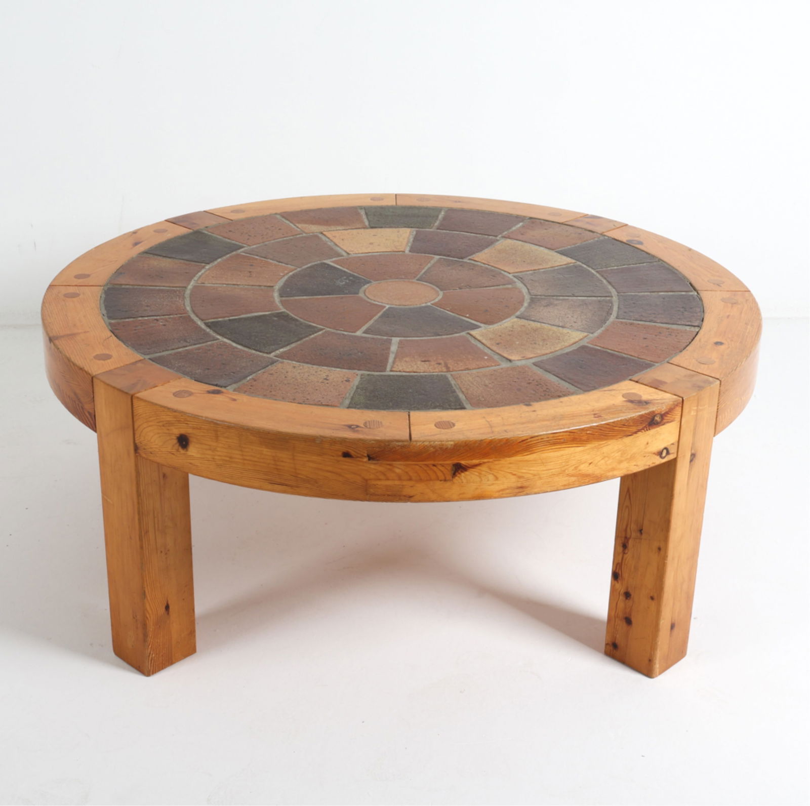 SALLINGBOE DANISH PINE & CERAMIC COFFEE TABLE: Mid 20th Century. Signed on tiles. Dimensions: H 19.5" x Dia. 49.5". Condition: Scuffs and scratches to legs. Nicks and dings to top edges. Wear consistent with age and use. DMK140