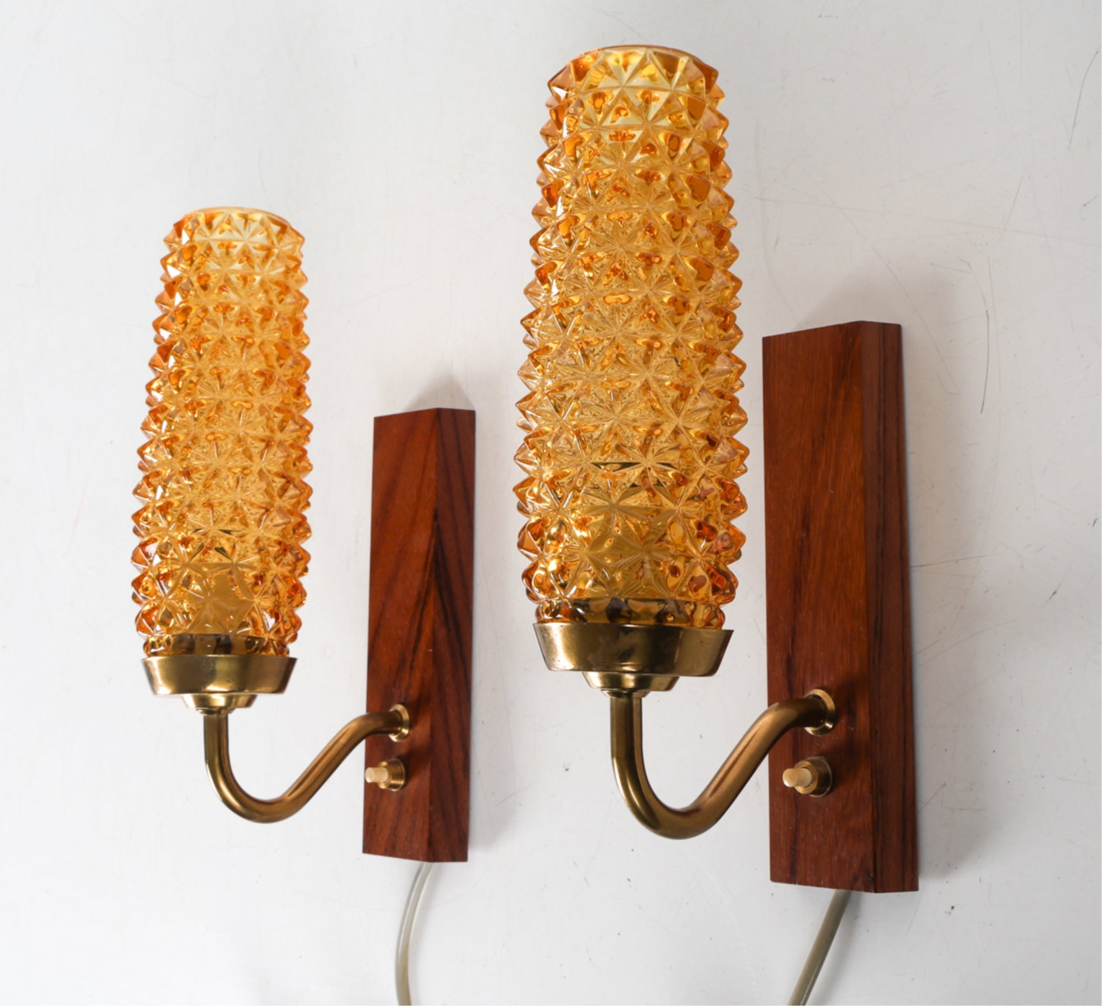 (2) LAONI BELYSNING 'TYPE 78' GLASS & TEAK SCONCES: Yellow textured glass. Circa 1960's. Dimensions: H 11" x W 5.25". Condition: Wiring untested. Few scuffs to brass. Wear consistent with age and use. DMK039