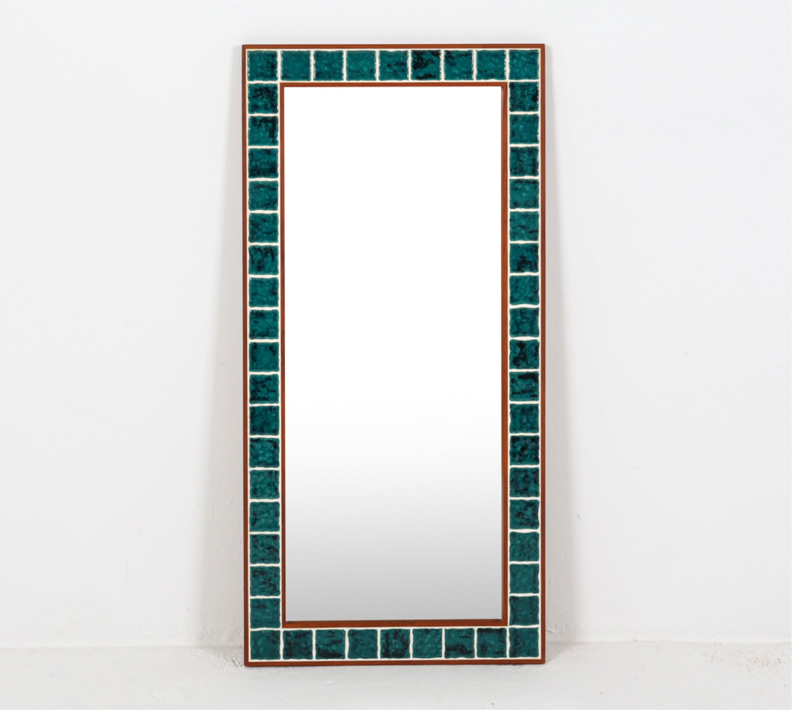 DANISH TEAK AND CERAMIC TILE FRAME MIRROR: Circa 1960's. Dimensions: H 40.25" x W 19.25". Condition: Few faint scuffs. Wear consistent with age and use.