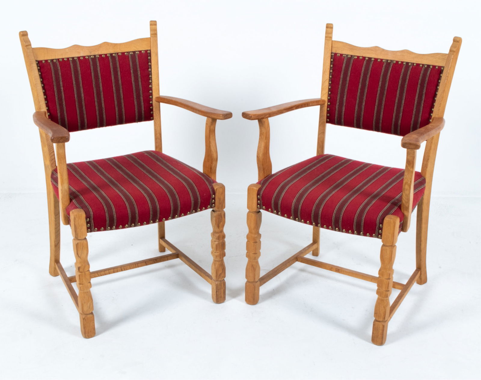 PAIR OF KJEARNULF STYLE OAK ARMCHAIRS, C.1970'S: Red wool upholstery. Denmark. Dimensions: H 37" x W 23.5" x D 19.25" x SH 17". Condition: Few rubs and discolored areas on arms. Wear consistent with age and use. B029