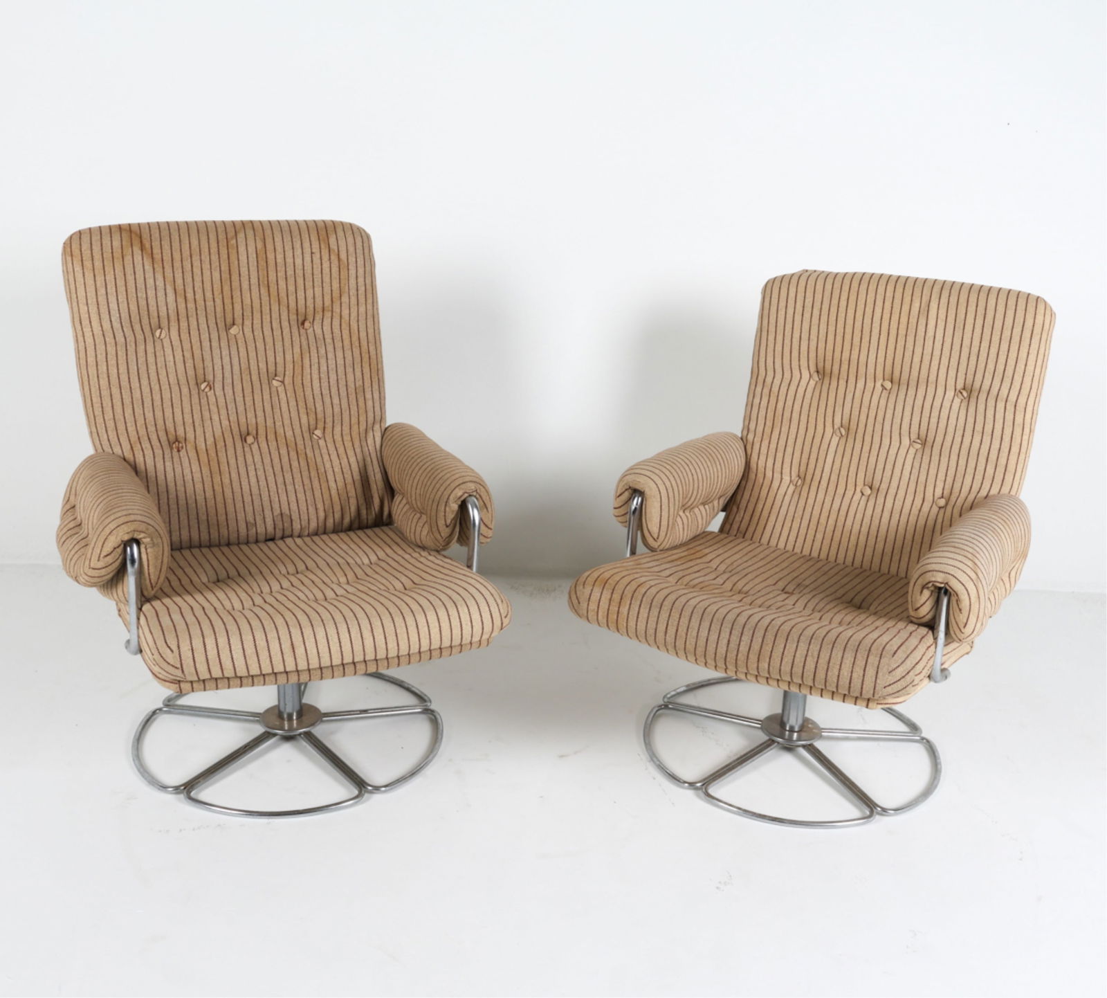 BRUNO MATHSSON FOR DUX CHROME SWIVEL CHAIRS: Striped fabric upholstery. Apparently unsigned. Sweden, circa 1960's. Dimensions: H 37.25" x W 28" x D 28" x SH 16". Condition: Some discoloration to fabric throughout, reupholstering recommended. Som