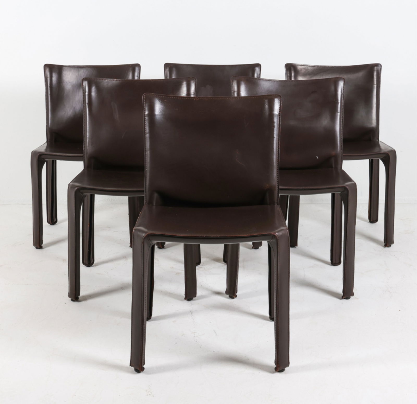 (6) CASSINA CAB 413 LEATHER DINING CHAIRS: Marked to undersides. Dimensions: H 31.25"x W 19" x D 18" Seat height 17.5" Condition: Marks and creases to leather. Rubbing to edges.