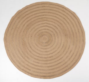 HAND-WOVEN ROUND RUG BY ANNIE SELKE