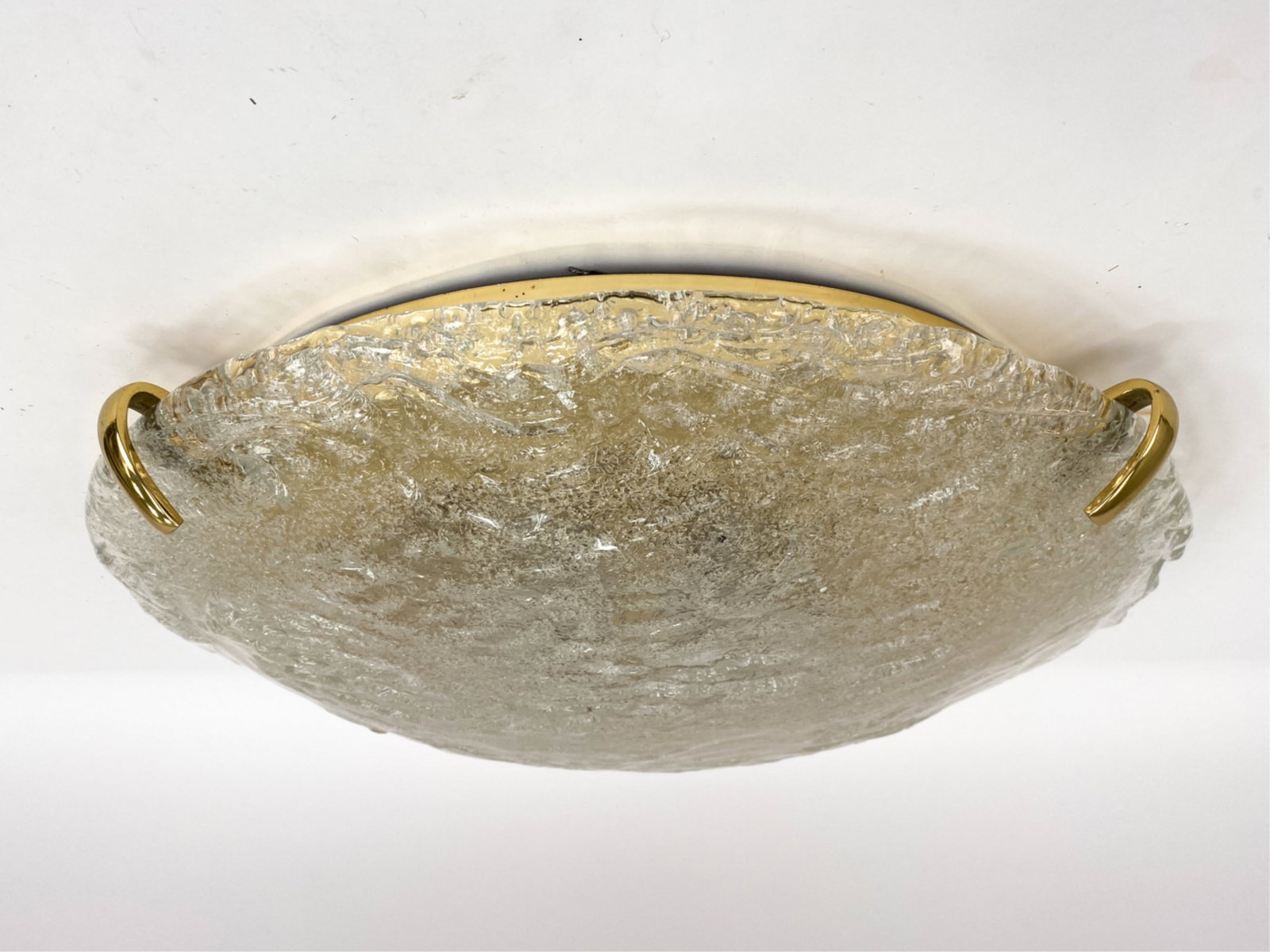 KALMAR AUSTRIA FLUSH MOUNT GLASS CEILING LIGHT: Dome shape ceiling light with brass frame and textured convex glass. Dimensions: Dia 23" Condition: Minor scuffs to brass frame and prongs. untested. PJ123