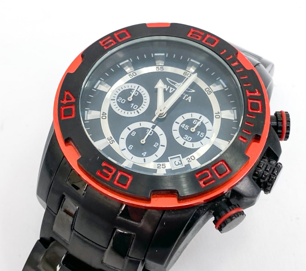 INVICTA PRO DIVER SCUBA CHRONOGRAPH MENS WATCH: Featuring a 50mm stainless steel case with a quartz movement. Model number 22323. Marked on face and on backside. Includes instructions manual, Invicta case for watch, and extra links to extend band.