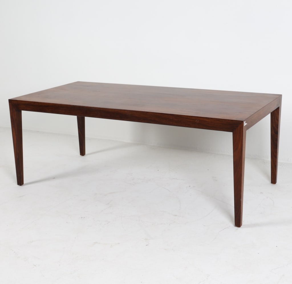 SEVERIN HANSEN FOR HASLEV ROSEWOOD COFFEE TABLE: Partial label underneath. Dimensions: H 20" x W 52.5" x D 26.5". Condition: Wear consistent with age and use.