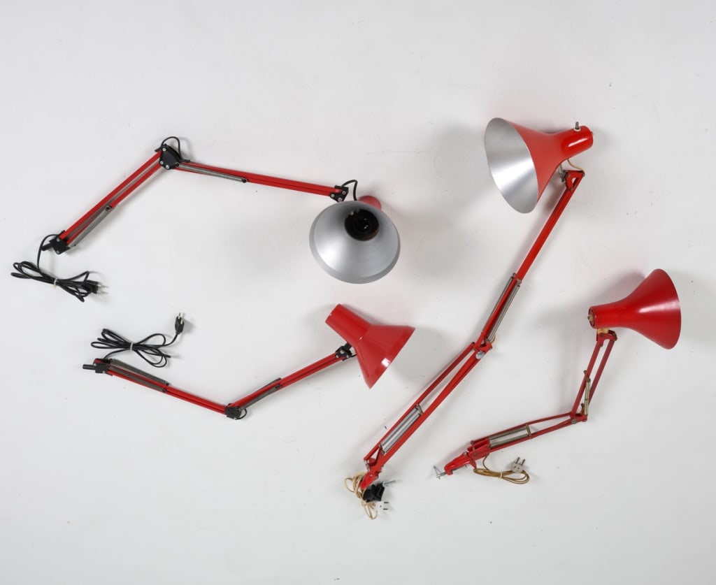 (4) VINTAGE ALUMINUM ARCHITECT LAMPS C.1970'S: Red toned steel posts with aluminum shades, and without table clamps. Dimensions: (longest) H 49" Condition: Minor soiling and marks to red paint. Wear consistent with age and use. European plugs, unt