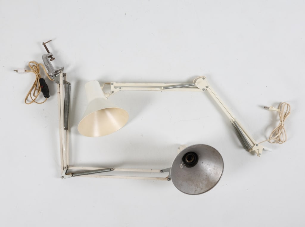 (2) VINTAGE ALUMINUM ARCHITECT LAMPS C.1970'S: White and off white painted steel with aluminum shades. One with steel table clamp. Dimensions: (largest) H 42" Condition: Wearing to paint. Surface scuffs and marks consistent with age and use. Europ