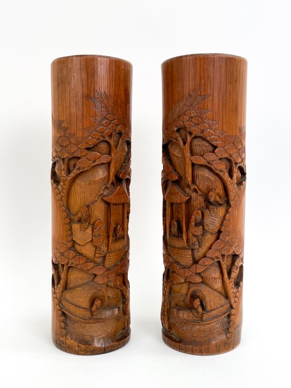 PAIR OF CHINESE CARVED WOOD BRUSH POT VASES: Scenes carved into the sides of both. Both with Chinese wax seals underneath. Dimensions: H 14.75" x Dia 4.25" Condition: Couple marks, rubs, naturally forming stress cracks. have of each seal remains