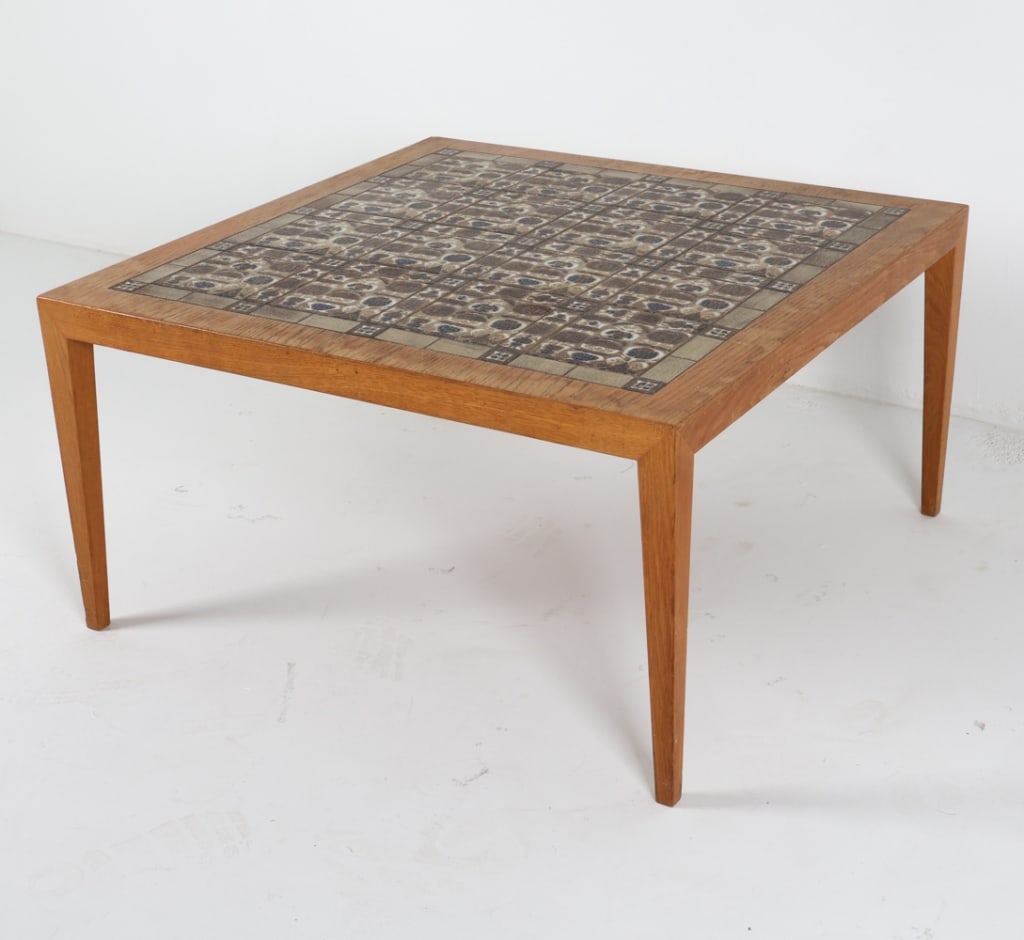 HASLEV DANISH OAK & TILE COFFEE TABLE C. 1970'S: Tag underneath. Designed by Severin Hansen, in collaboration with Royal Copenhagen. Dimensions: H 19.75" x W 37.75" x D 37.75". Condition: Fading and water marks on top. Wear consistent with age and u