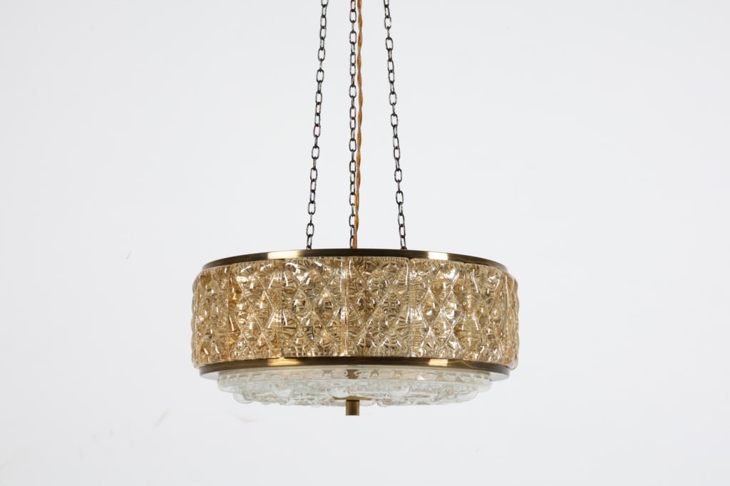 ORREFORS GLASS & BRASS PENDANT LAMP C.1960'S: Textured glass panels to sides and underside. Brass top. Dimensions: H 8" x Dia 14" Condition: Minor Scuffs, marks, and tarnishing to brass. Untested. Wear consistent with age and use. A136
