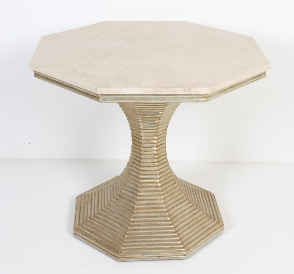 BUNNY WILLIAMS MARBLE TOP HOURGLASS TABLE: Contemporary. Octagonal Crema Marfil marble top on ribbed hour-glass shaped base, with gilded finish. Dimensions: H 27.5" x W 32.25" x D 32.25". Condition: Few light scuffs to top. Some rubs to painte