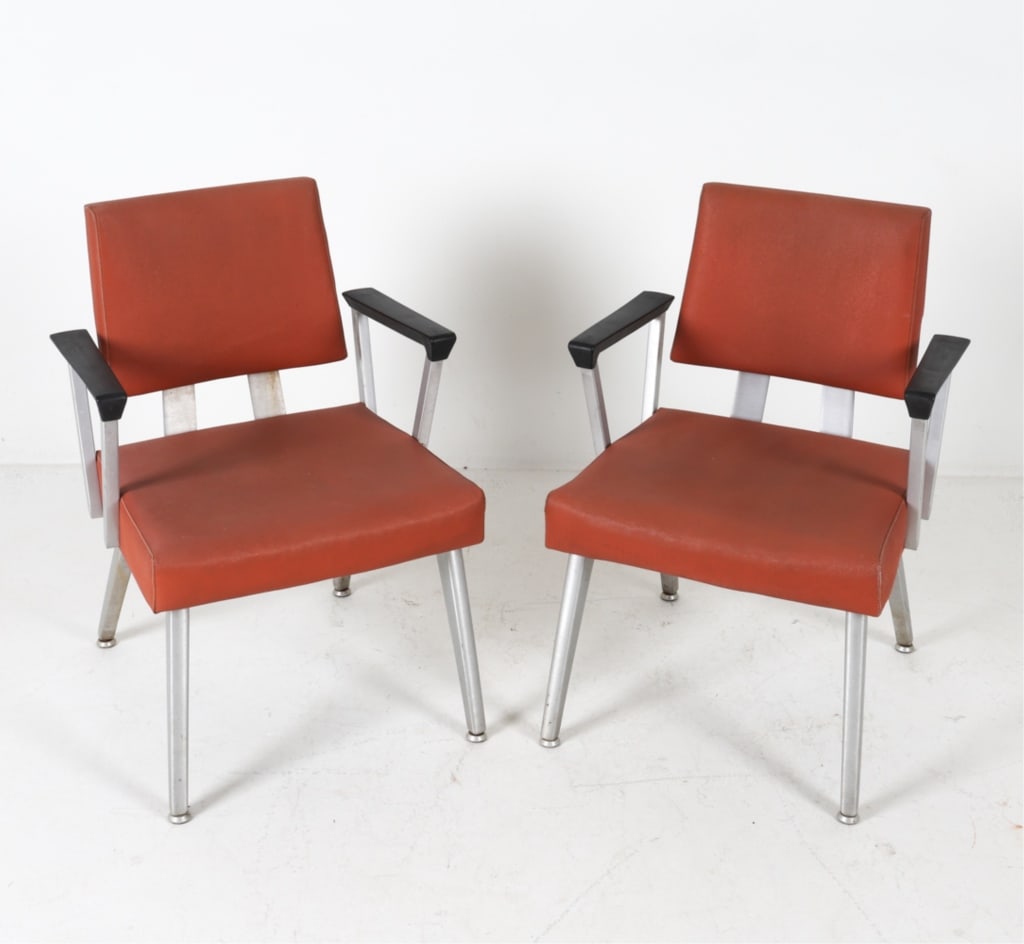 PAIR MID-CENTURY GOODFORM ARMCHAIRS: Aluminum frames with orange vinyl upholstery. Dimensions: H 31.5" x W 22" x D 20" x SH 17". Condition: General fading, surface soiling. Few scuffs and dings to metal. Wear consistent with age and use