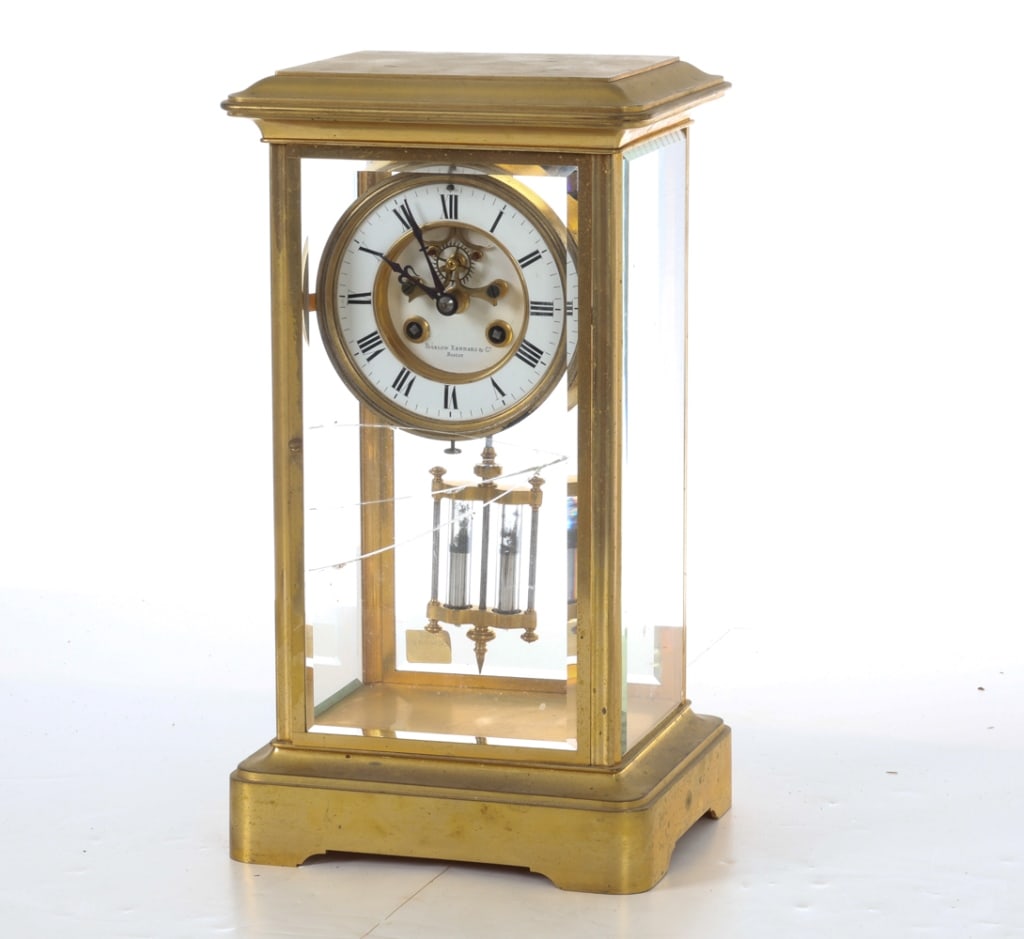 BIGELOW KENNARD & CO BRASS & GLASS MANTEL CLOCK: Beveled glass panels with brass works. Dial is signed. Movement marked 'Brocot & Co'. Key and pendulum included. Mercury in pendulum. Boston, USA Dimensions: H 13.75" x W 7.75" x D 6". Condition: Time