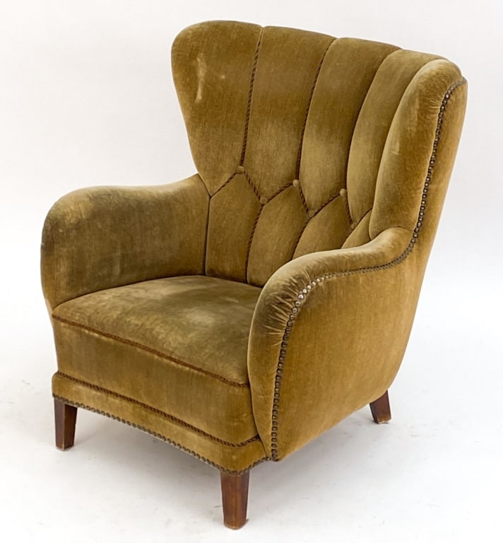 MANNER OF FLEMMING LASSEN DANISH EASY CHAIR: Velvet easy chair in the manner of Flemming Lassen, unsigned. With rope and tufted designs and tacking around edges. Circa 1940's. Dimensions: H 38" x W 32.5" x D 36" x SH 15" Condition: Rubs to legs