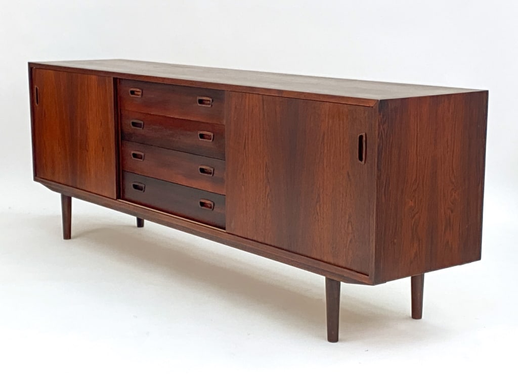 KOEFOED HORNSLET ROSEWOOD SIDEBOARD, C. 1960'S: Marked on back corner, Hornslet Mobelfabrik, made in Denmark. Dimensions: H 27.75" x W 78.75" x D 17" Condition: Very minimal surface wear consistent with age and use including couple stray marks. One