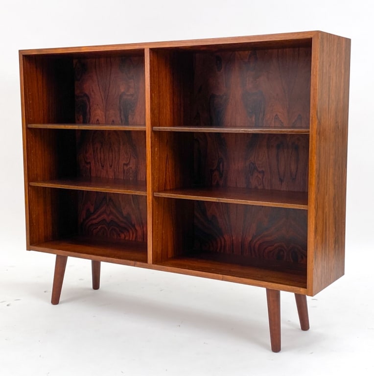 ATTR. GUNNI OMANN FOR OMANN JUN ROSEWOOD BOOKCASE: Circa 1960's. Unmarked. Dimensions: H 38.5" x W 47.25" x D 11.5" Condition: Legs may not be original. Some edge rubs, nicks, and light scratches to top consistent with age and use. JE132
