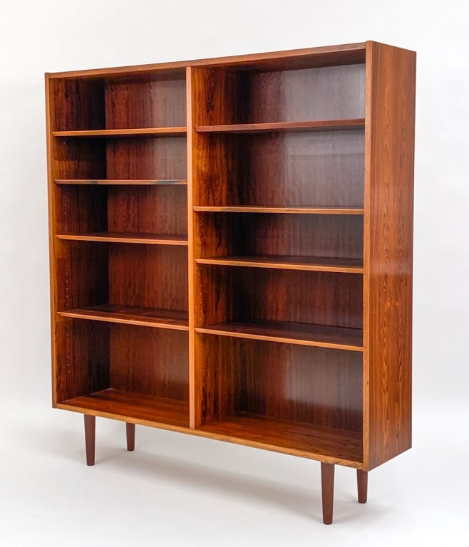 POUL HUNDEVAD FOR HU MOBLER ROSEWOOD BOOKCASE: With HU Mobler and Danish furniture stamp on back panel. Designed by Poul Hundevad for HU Mobler. Circa 1960's. Dimensions: H 58.75" x W 54.25" x D 12" Condition: Light surface wear including spots of