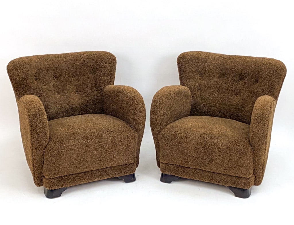 DANISH LAMBSWOOL LOUNGE CHAIRS MANNER OF LASSEN: Pair of Danish easy chairs in the manner of Flemming Lassen. Made from Beechwood with brown lambs wool upholstery. Circa 1940's. Unmarked. Dimensions: H 30" x W 30" x D 33" x SH 16" Condition: Legs wi