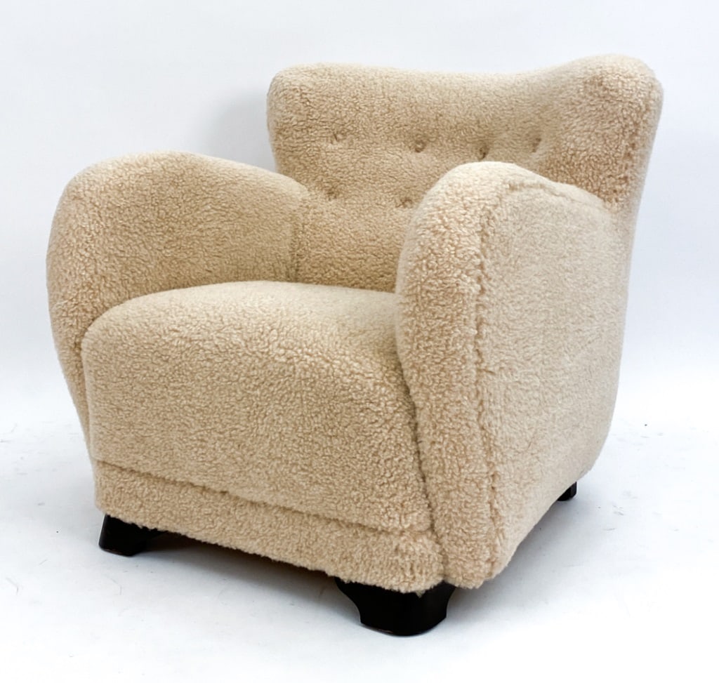 MANNER OF FLEMMING LASSEN DANISH LOUNGE CHAIR: Danish lounge chair in the manner of Flemming Lassen, Circa 1940's. Made from beechwood with lamb's wool upholstery. Dimensions: H 30.5" x W 30" x D 32" x SH 16" Condition: Couple rubs to legs. JE155