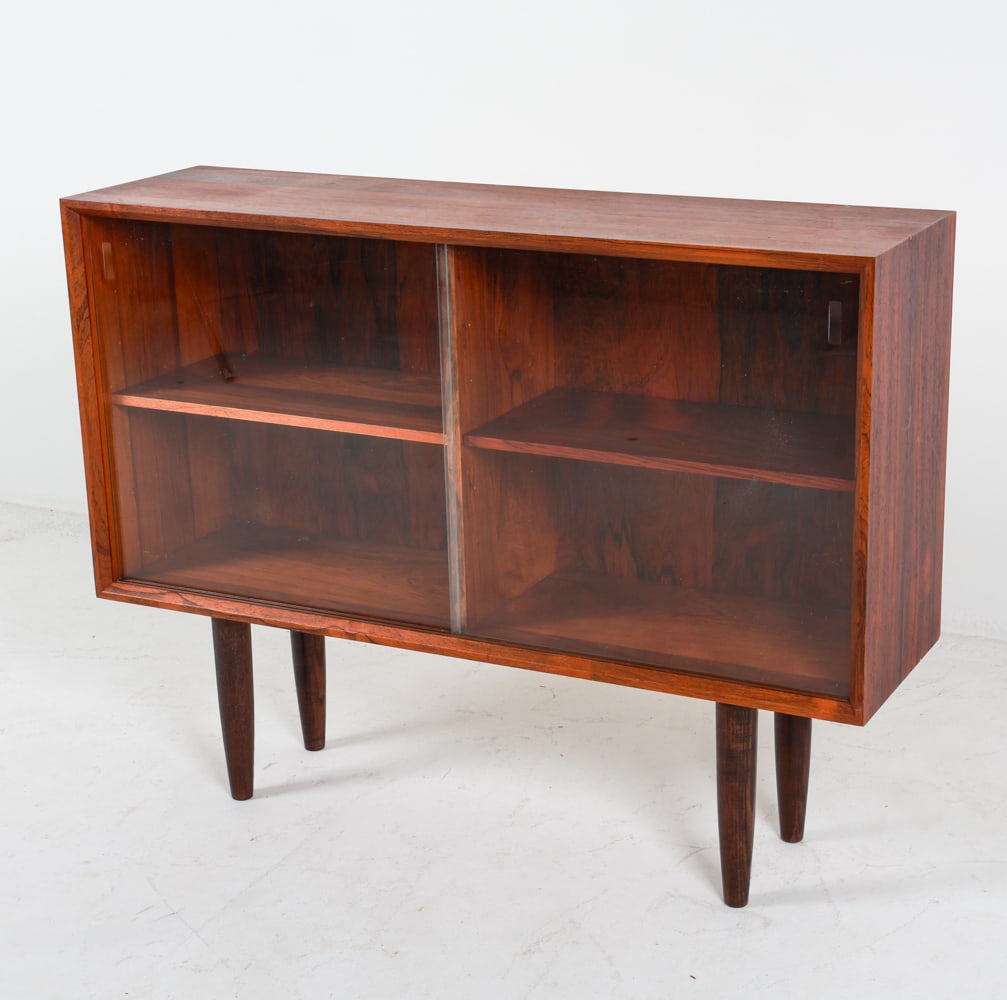 DANISH ROSEWOOD & GLASS CABINET C. 1960'S: Recessed cabinet door pulls. Adjustable shelves. Dimensions: H 30.25" x W 39.5" x D 11". Condition: Wear consistent with age and use. PER C088