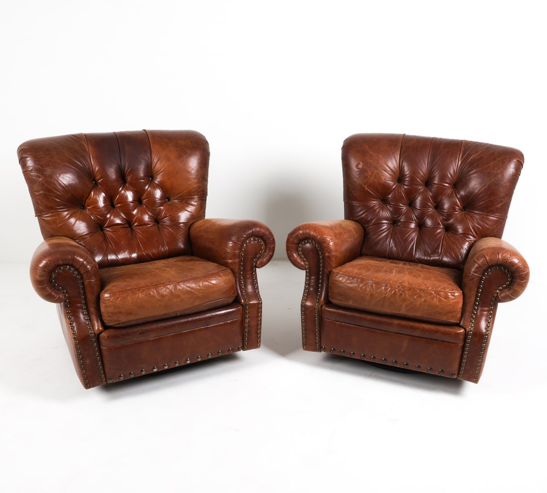 PAIR OF CHESTERFIELD STYLE LEATHER RECLINERS: Tufted leather upholstery with brass tacks accents. Scandinavian, Late 20th c. Dimensions: H 39.5" x W 39" x D 37" x SH 20". Condition: Wear consistent with age and use. Some fading and rubbing to the