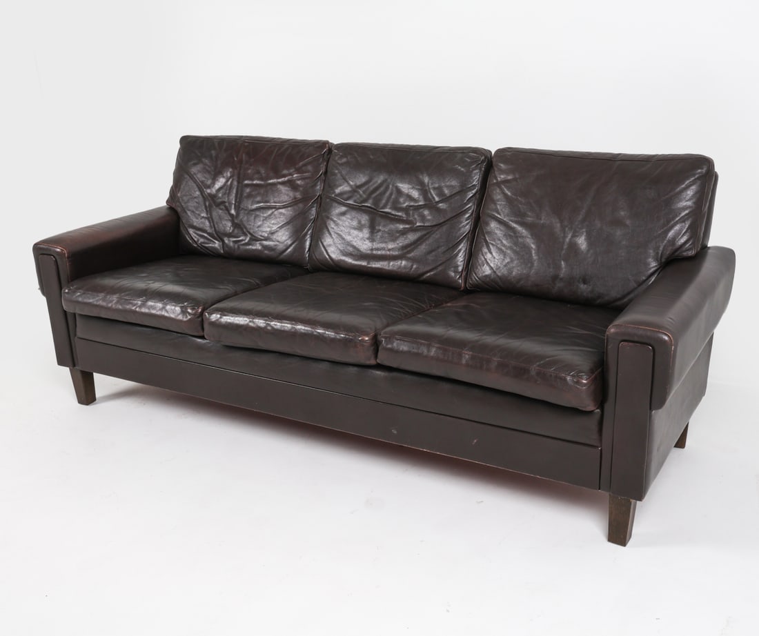 DANISH MID-CENTURY LEATHER SOFA C. 1970'S: Dimensions: H 31" x W 76.5" x D 31" x SH 17.5". Condition: Some wear to leather, few rubs mostly along seams. Wear consistent with age and use. PER C149