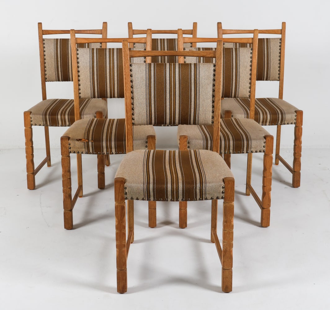 (6) KJAERNULF STYLE DANISH OAK DINING CHAIRS: Circa 1970's. Dimensions: H 36.5" x W 17.5" x D 19" x SH 18.25". Conditions: Tear to upholstery in one seat, pictured. Wear consistent with age and use. PER C156