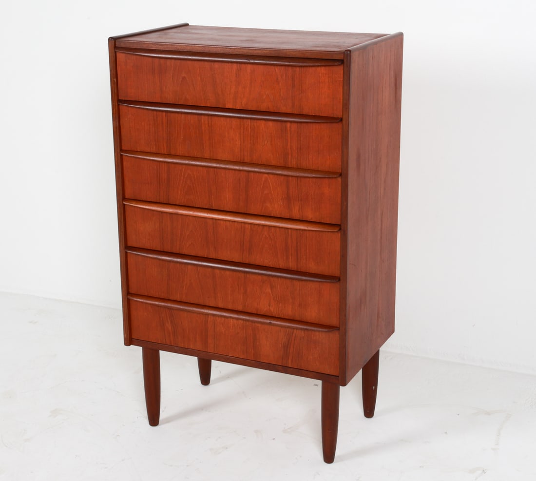 DANISH TEAK CHEST OF DRAWERS C. 1970'S: Dimensions: H 43" x W 25.5" x D 15.75". Condition: Slight tobacco odor. Few surface scuffs and scratches. Wear consistent with age and use. G053