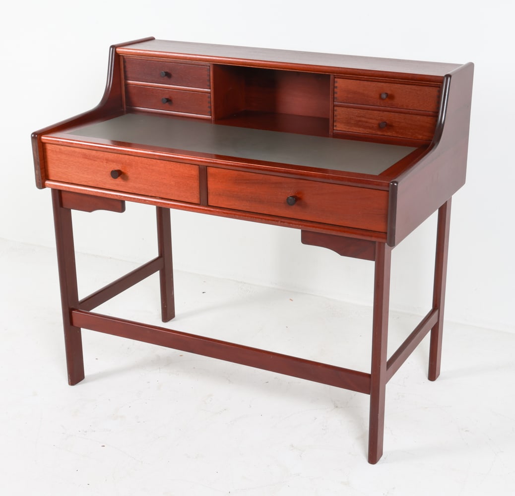 STOFA DANISH MAHOGANY WRITING DESK C. 1980'S: With writing pad inlaid on desk. Tag underneath. Dimensions: H 37.75" x W 41.5" x D 23.25". Condition: Smaller drawers move with some difficulty. Few scuffs, rubs, light surface scratches. Wear consis