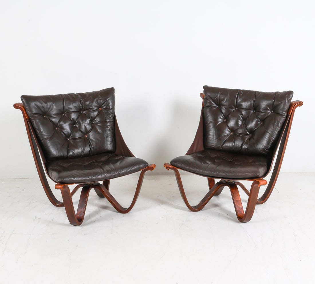 PAIR GEORGE THAMS LEATHER LOUNGE CHAIRS C. 1970'S: For A/S Vejen. Tag under cushion. Leather cushions with canvas 'sling' seat, suspended from frame. Dimensions: H 31" x W 31" x D 28" x SH 15.5". Condition: Minor signs of wear to leather seat and stra