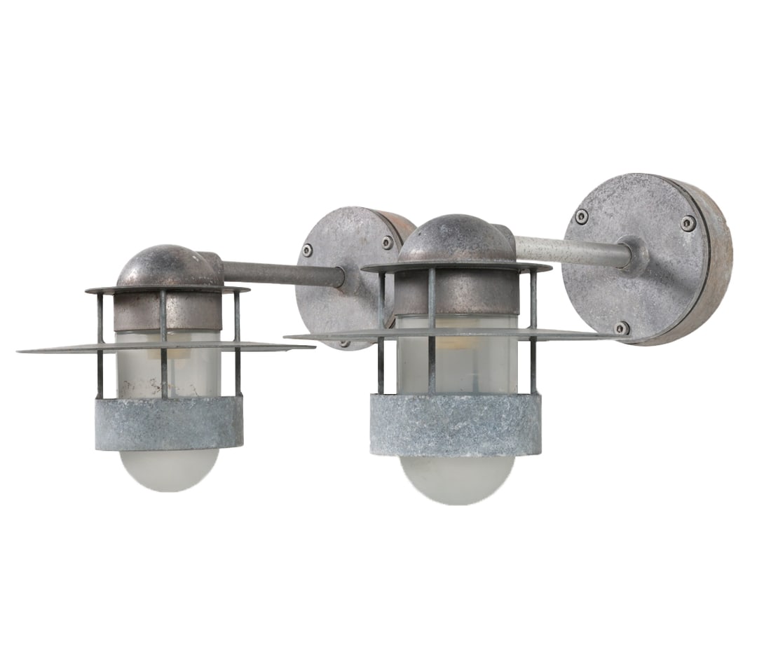 PAIR OF NORDLUX STEEL OUTDOOR SCONCES C. 1970'S: Dimensions: H 10" x Dia. 10" x D 17". Condition: Wiring untested. oxidization to steel. Wear consistent with age and outdoor use. G028