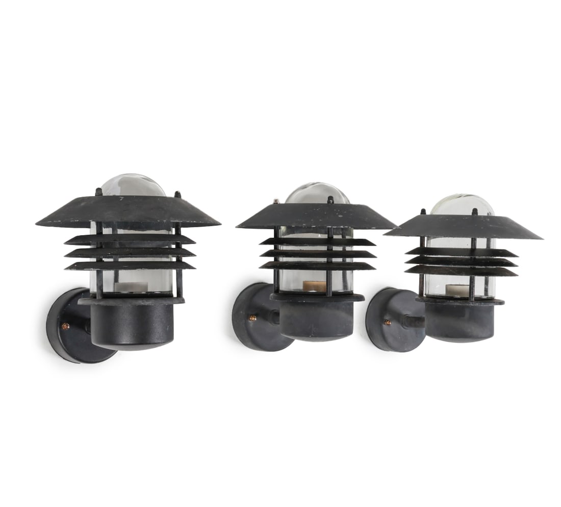 NORDLUX OUTDOOR SCONCES C. 1970'S: Includes (3) sconces. Dimensions: H 12" x W 11.5" x D 11.5". Condition: Wiring untested. Scattered scuffs and scratches to shades, some wear to finish. Wear consistent with age and outdoor use. G068