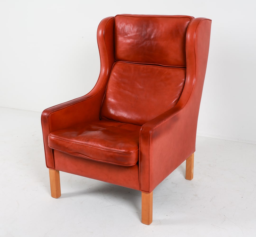 MOGENS HANSEN LEATHER WINGBACK CHAIR: Straight beech legs. Denmark. Dimensions: H 42" x W 28.25" x D 29" x SH 17". Condition: Some discoloration to leather cushions, few rubs along edges. Wear consistent with age and use. G106