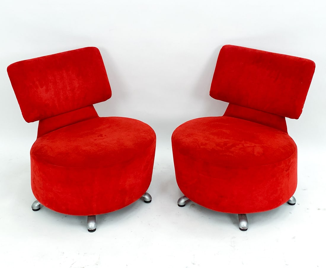 TOSHIYUKI KITA CASSINA 'AKI' SWIVEL LOUNGE CHAIRS: Cassina label to underside. Designed by Toshiyuki Kita Circa. 2000 With Red suede upholstery. Dimensions: H 28" x W 24.5" x D 24" Seat height: 15" Condition: Moderate pilling and rubbing to suede upho