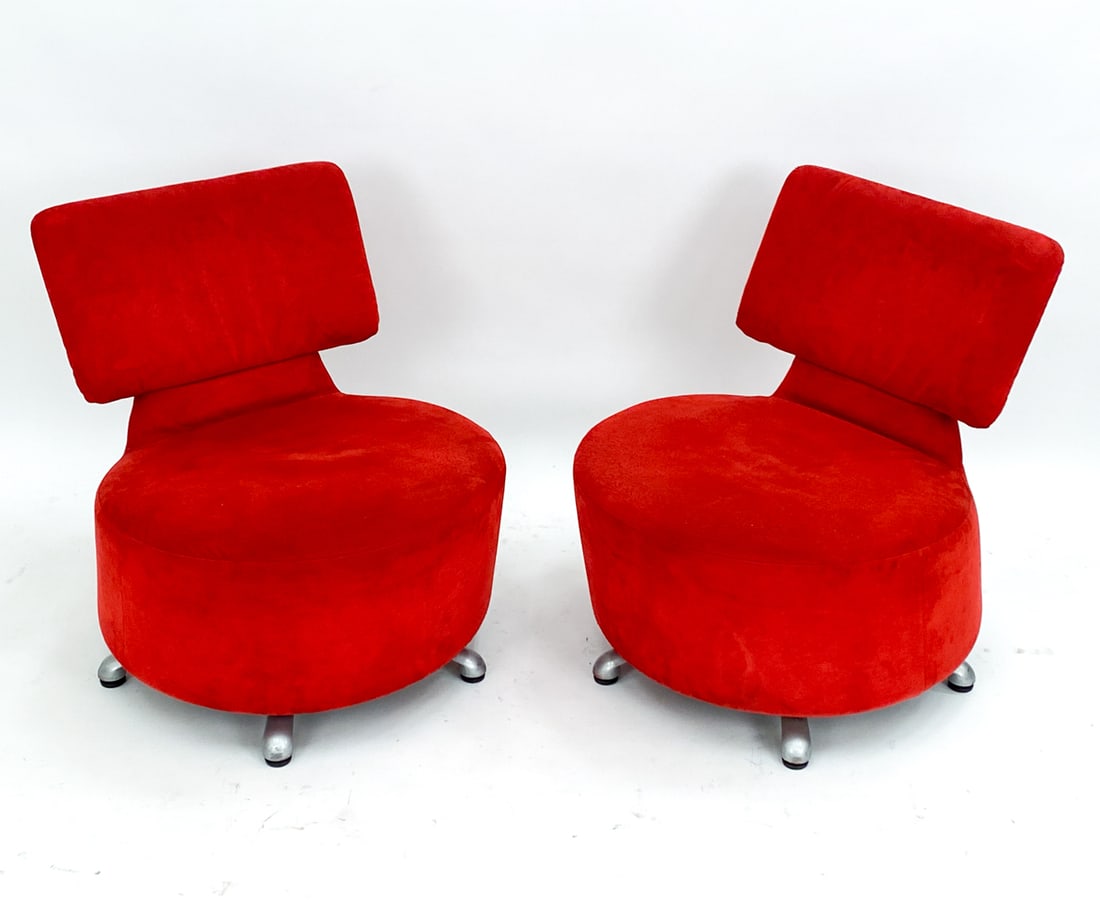 TOSHIYUKI KITA CASSINA 'AKI' SWIVEL LOUNGE CHAIRS: Cassina label to underside. Designed by Toshiyuki Kita Circa. 2000 With Red suede upholstery. Dimensions: H 28" x W 24.5" x D 24" Seat height: 15" Condition: Moderate pilling and rubbing to suede upho