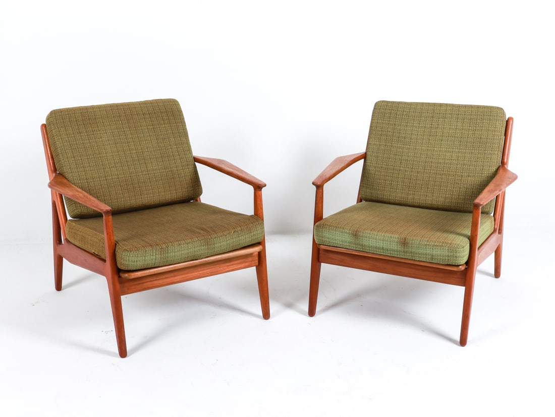 (2) ARNE VODDER DANISH TEAK LOUNGE CHAIRS C. 1960S: Stamped VAMO to undersides. Dimensions: H 27.5" x W 29" x D 29" Seat height: 15" Condition: Slight rubbing on arm rests and frames. Fraying, tears and sun fading to wool cushions. Wear consistent with
