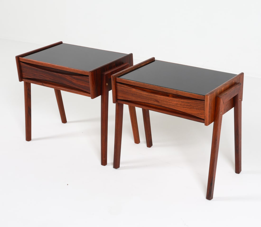 ATTR. ARNE VODDER DANISH ROSEWOOD NIGHTSTANDS: With glass tops. Denmark circa 1970's. Dimensions: H 16.25" x W 17.5" x D 11". Condition: Few light scuffs to wood and glass. Wear consistent with age and use. C049