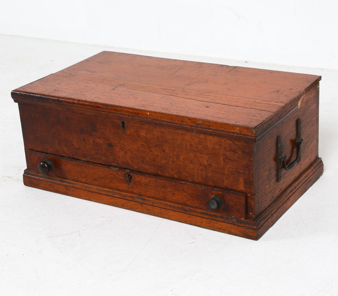 ANTIQUE 19TH C. OAK GENTLEMAN'S CHEST: Old labels under lit. Iron hardware. Dimensions: H 8.25" x W 19.75" x D 11". Condition: Few broken pieces from lid edge, included. No key. Scuffs, scratches, stress crack on top. Wear consistent with 