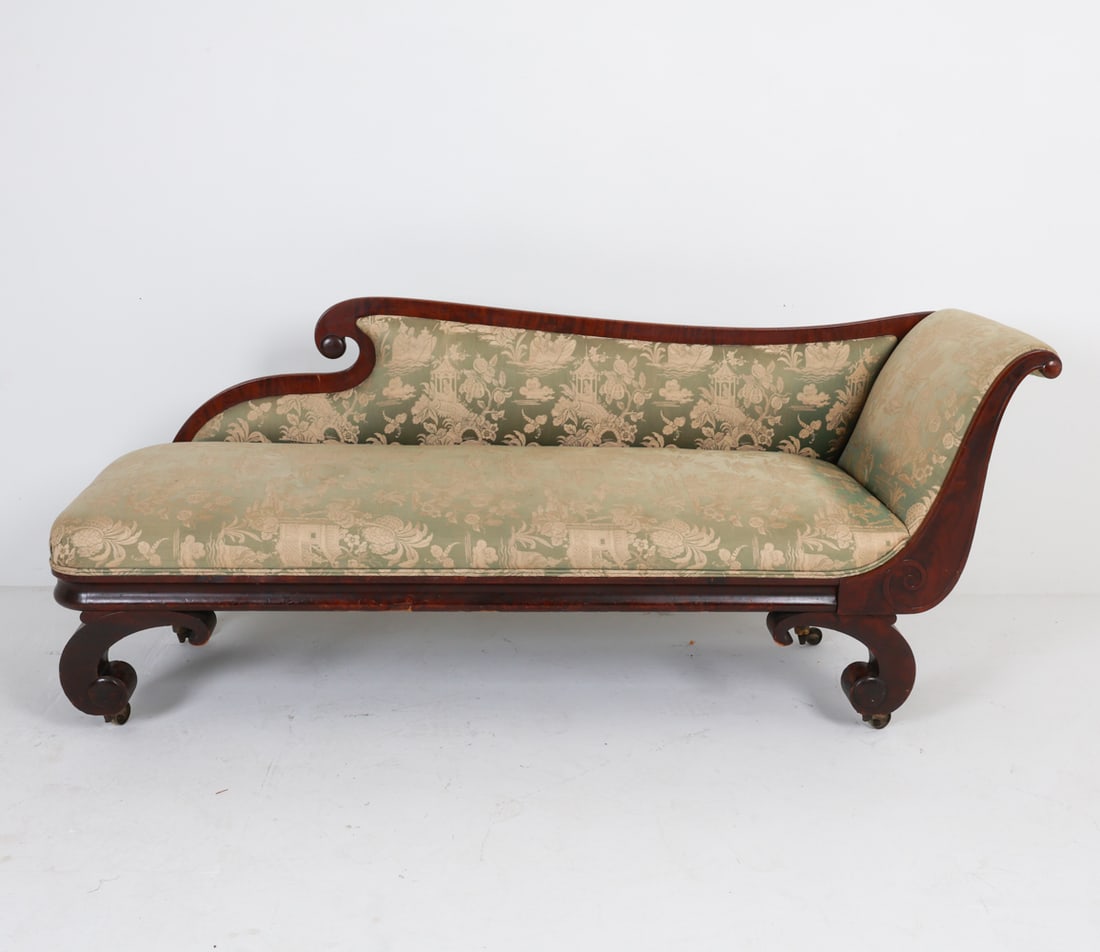 ANTIQUE MAHOGANY CHAISE LOUNGE DAYBED: Mahogany veneer with fabric upholstery. Early 20th century. reupholstered. Dimensions: H 31" x W 80" x D 22.25". Condition: Rubs, scuffs, dings to wood. Few stress cracks and splits to veneer. some se