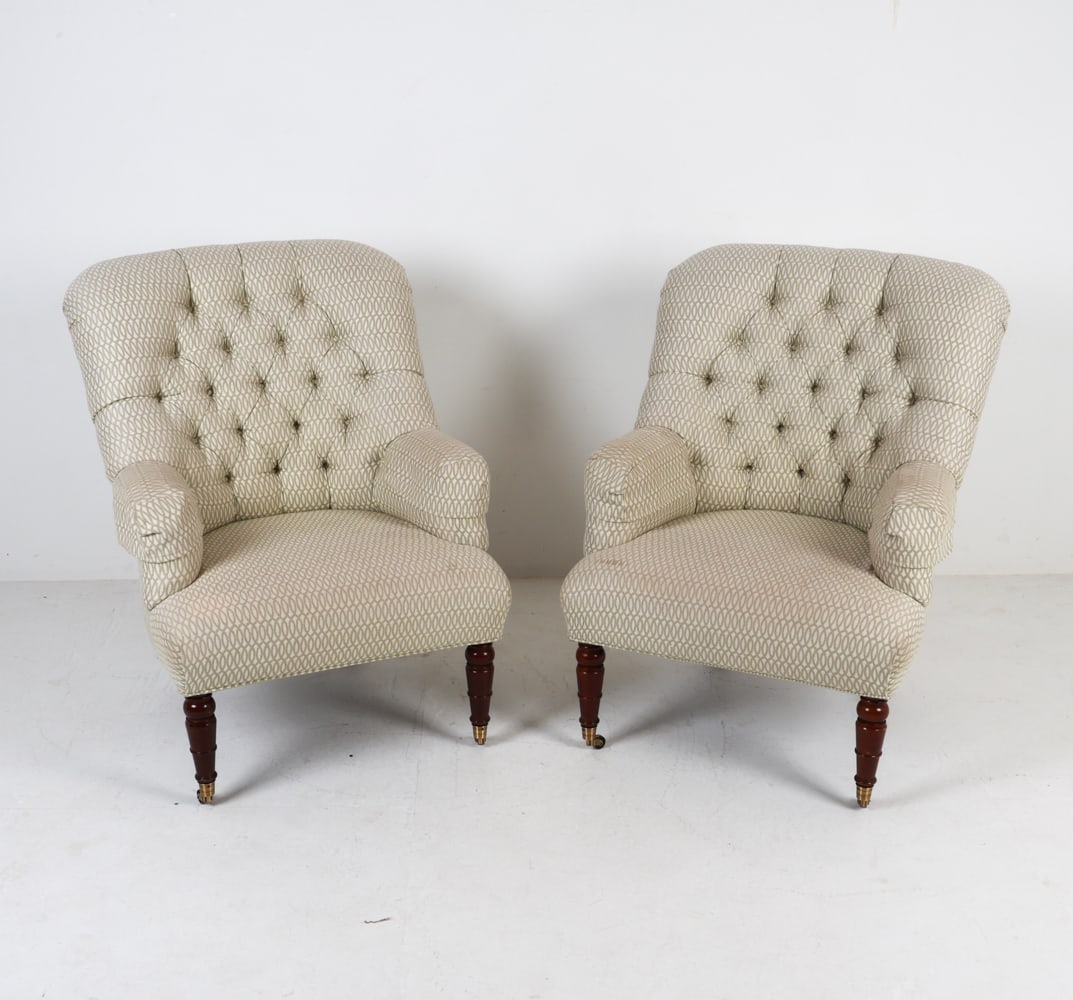 PAIR OF CALICO CORNERS LOUNGE CHAIRS: Label to undersides. Brass casters. Dimensions: H 41" x W 30" x D 26" Seat height: 17". Condition: Slight scuffs and marks on legs. blemishes on upholstery.
