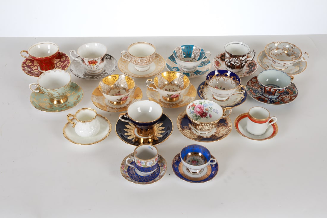 GROUPING OF PORCELAIN TEA CUPS & SAUCERS: Includes: (16) tea cups and (17) saucers. Dimensions: Largest Cup H 2.5" x Dia. 4". Largest saucer Dia. 5.5". Condition: Wear consistent with age and use.