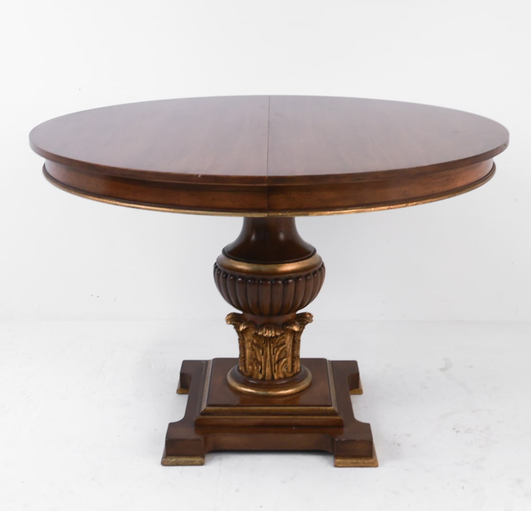 MAHOGANY PEDESTAL DINING TABLE: Pedestal dining table with gilt floral carved designs. Expandable, but without leaves. Dimensions: H 30" x Dia 42" Condition: No leaves. Rubbing and losses to gilt to pedestal and edges. Scattered sur