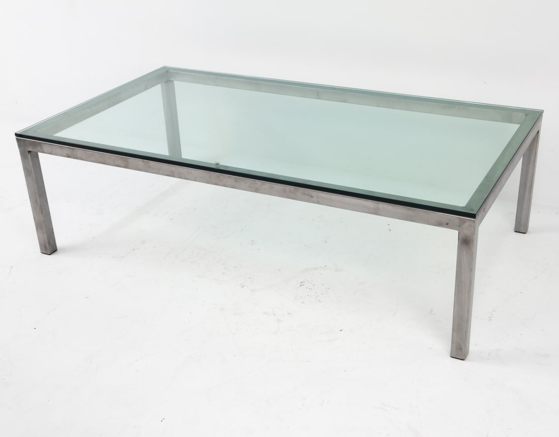 MID-CENTURY STEEL & GLASS COFFEE TABLE: Dimensions: H 16" x W 54" x D 30" Condition: Slight scattered marks and scuffs on frame. Glass presents well overall. Wear consistent with age and use.