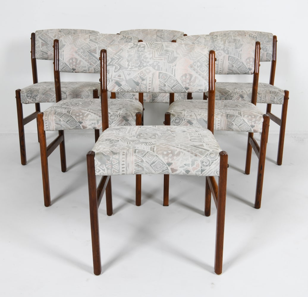 (6) DANISH ROSEWOOD DINING CHAIRS C. 1960'S: Rosewood with patterned fabric upholstery. Dimensions: H 30.5" x W 18" x D 18.5" x SH 18". Condition: Few scuffs and rubs to wood. Small spots of discoloration to fabric. Wear consistent with age and 